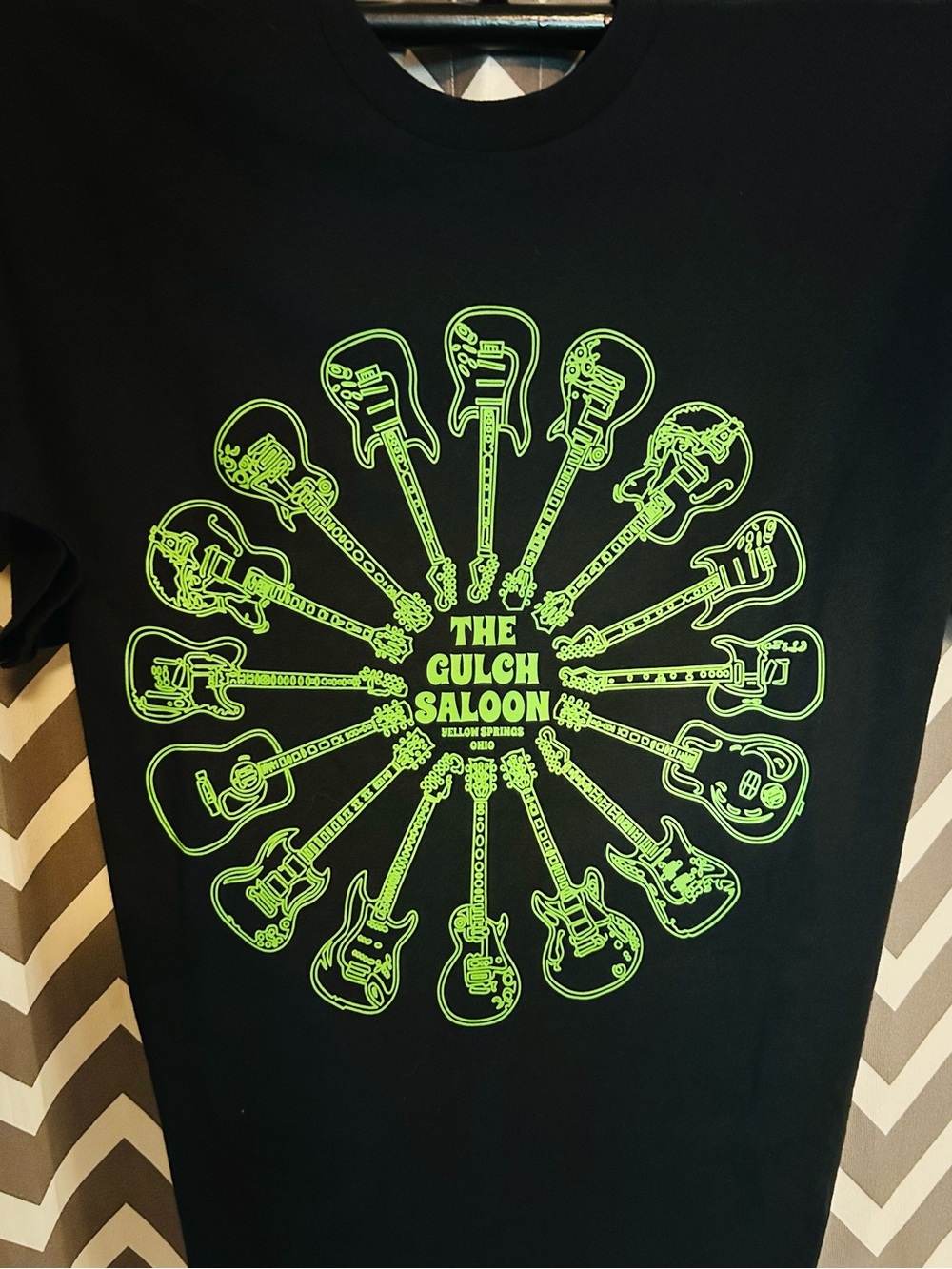 The Gulch Saloon Men's Black T-Shirt with Neon Green Guitar Graphic